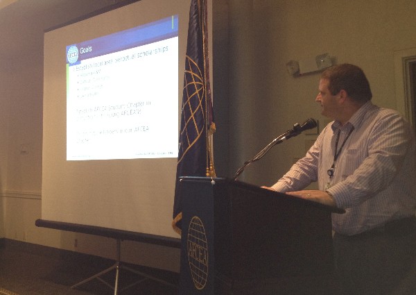 Rick Tuggle, chapter scholarship chair, presents the chapter's new scholarship program during the September luncheon.